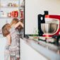 girls peek inside refrigerator in kitchen at home 2026 01 05 06 03 27 utc 85x85